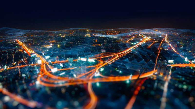 long exposure of movin traffic through a busy city at night