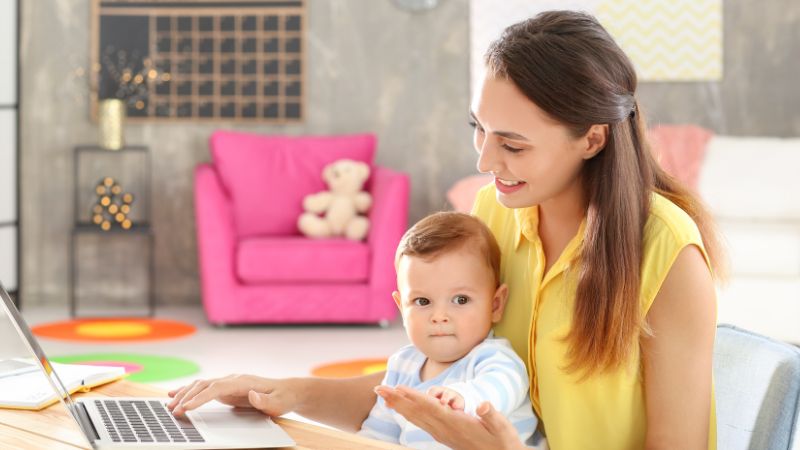 mother and child looking at a laptop